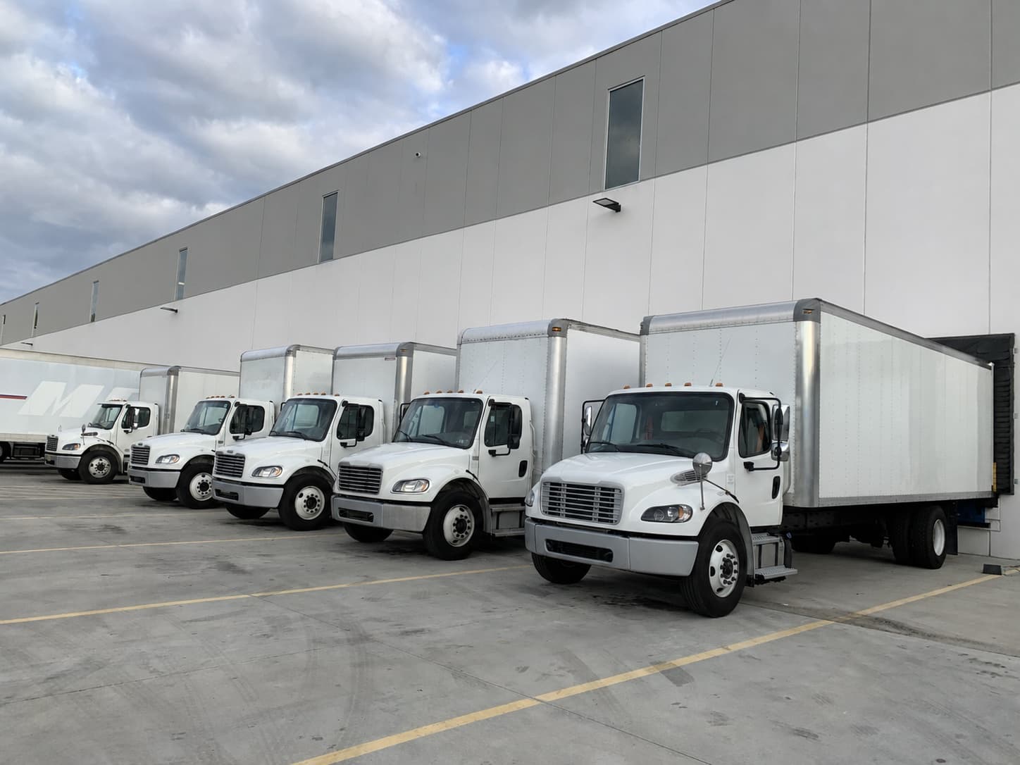 R&C box trucks positioned at warehouse loading docks